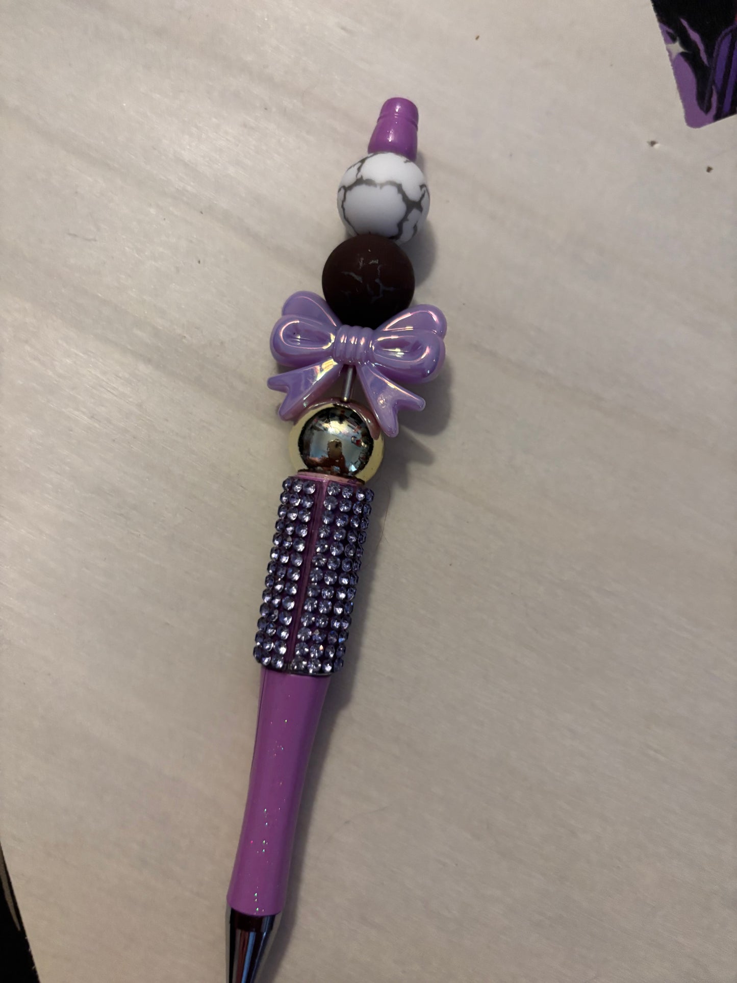 Purple bow pen