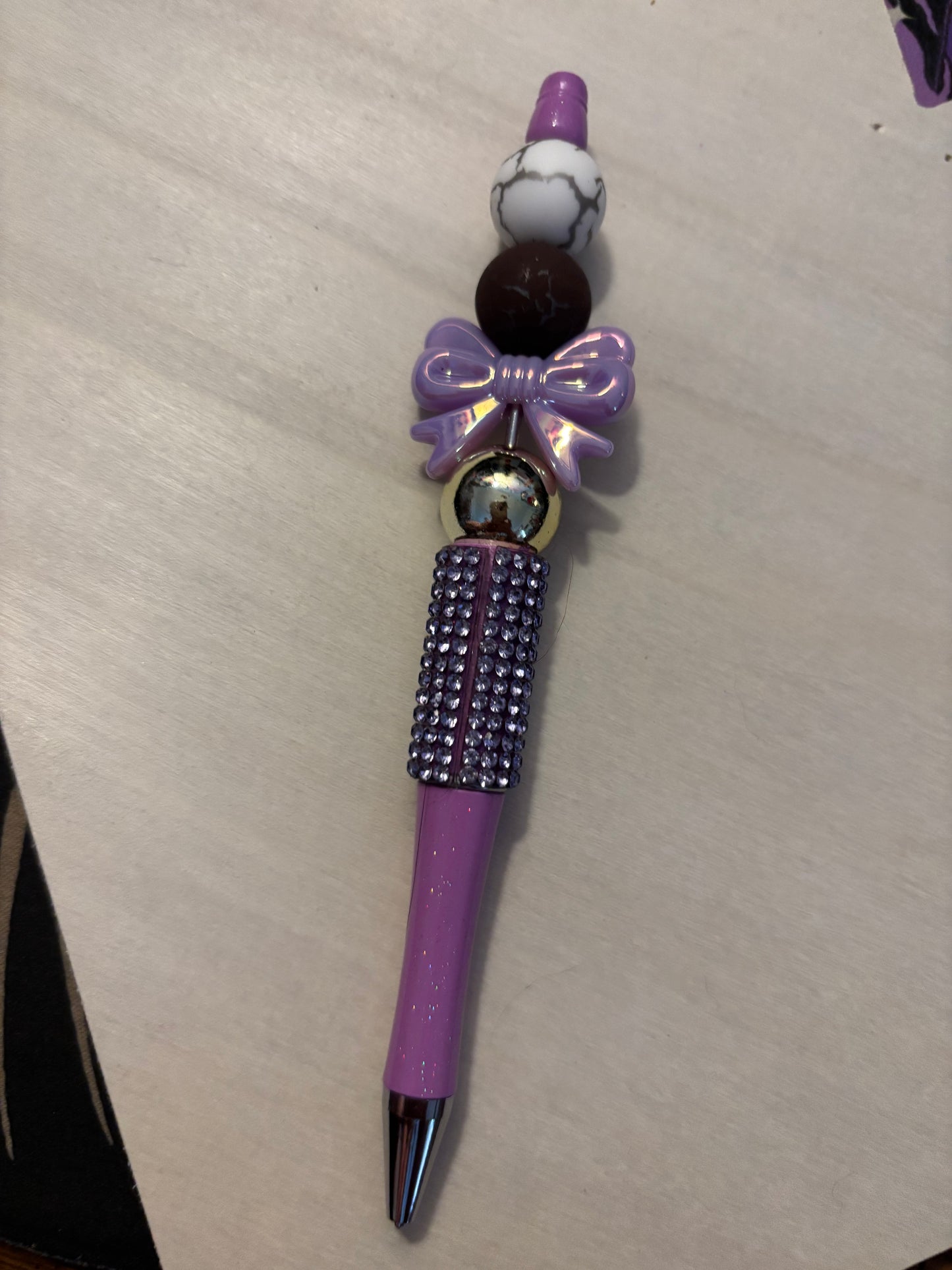 Purple bow pen